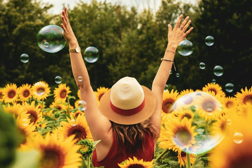 woman in hat in sunflower patch